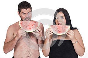 Deaf man and woman eating water melon