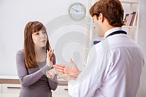 The deaf-mute female patient visiting young male doctor