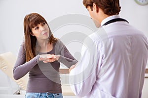 The deaf-mute female patient visiting young male doctor