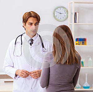 Deaf-mute female patient visiting young male doctor