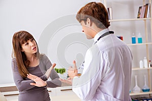 The deaf-mute female patient visiting young male doctor photo