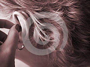 Deaf woman with hearing aid