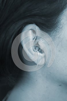 Deaf woman hearing aid ear