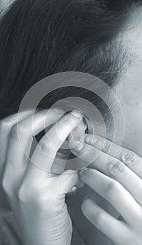 Deaf woman hearing aid ear