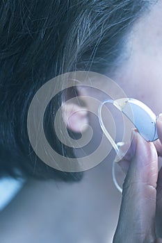 Deaf woman hearing aid ear