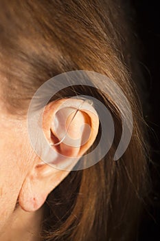 Deaf woman hearing aid ear