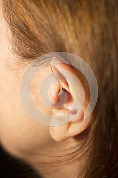 Deaf woman hearing aid ear