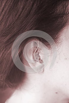 Deaf woman hearing aid ear