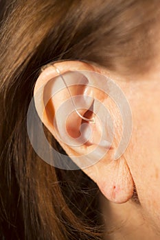 Deaf woman hearing aid ear