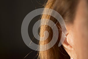 Deaf woman hearing aid ear