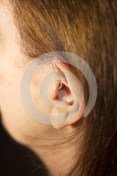 Deaf woman hearing aid ear