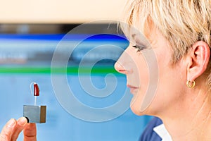 Deaf woman with hearing aid photo