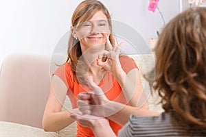 Deaf woman learning sign language photo