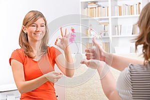 Deaf woman learning sign language photo