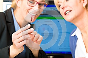 Deaf woman makes a hearing test photo