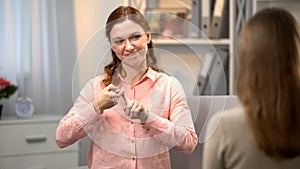 Deaf woman saying you are my best friend, sign language communication, gesture photo