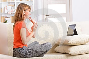 Deaf woman using sign language on the tablet