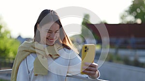 Deaf woman using sign language during video call on mobile