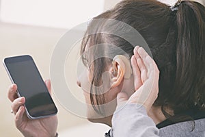 Deaf woman using smartphone