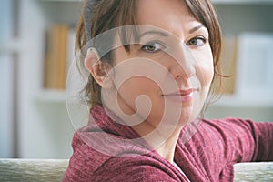 Deaf woman wearing hearing aid
