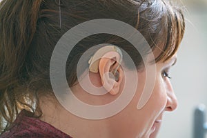 Deaf woman wearing hearing aid