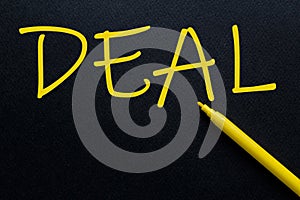 DEAL Yellow Pen with yellow text own rent at the black background