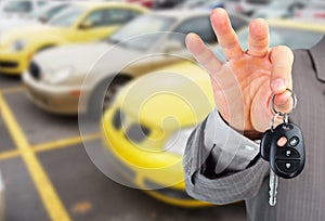 Dealer hand with a car key. photo