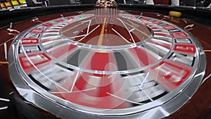 Dealer starts roulette wheel clockwise, spin. Ball rotates counterclockwise inside drum. European Casino. Gambling