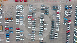 Dealership parking lot, many cars top aerial view