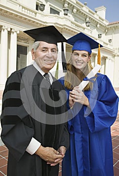 Dean and graduate outside university photo