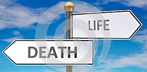 Death and life as different choices in life - pictured as words Death, life on road signs pointing at opposite ways to show that