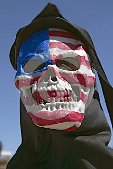 Death mask with an American flag of the grim reaper at George W. Bush and anti-America protest in Tucson, AZ