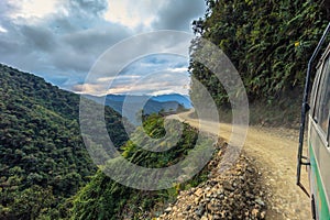 Death Road - July 25, 2017: Tour bus travelling in the Yungas road, or Death Road, Bolivia