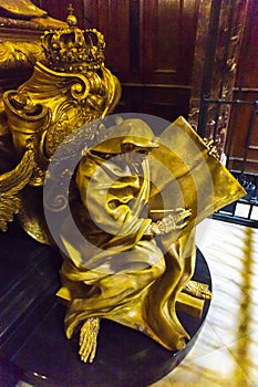 Death statue guarding a royal coffin