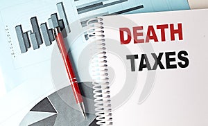 DEATH TAXES text on notebook on chart background