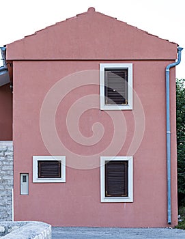 Deatil of a facade of a pink building