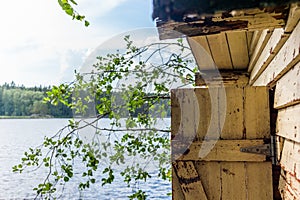 Deatil of an old wooden changing cabin on the shore of the Saimaa lake in Finland - 5