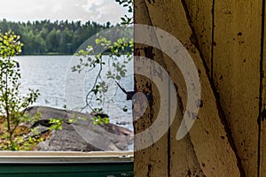 Deatil of an old wooden changing cabin on the shore of the Saimaa lake in Finland - 7