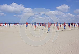 Deauville beach in Northern France with its famous colorful parasols.