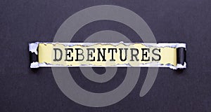 debenture word in a dictionary. debenture concept photo