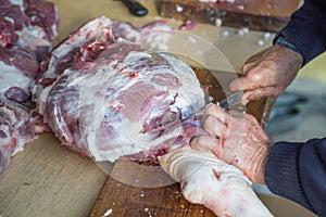 Debone pork shoulder