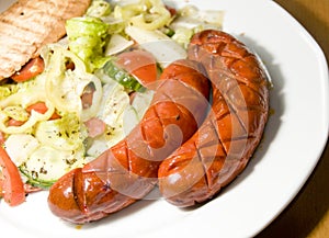 Debrecziner Hungarian sausage with salad