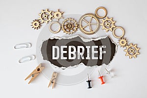 debrief word in a dictionary. debrief concept
