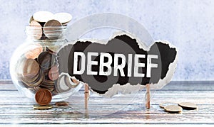 debrief word in a dictionary. debrief concept