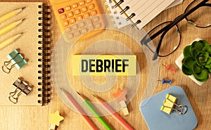 debrief word in a dictionary. debrief concept