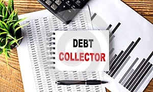 DEBT COLLECTION text on notebook on chart with calculator and pen