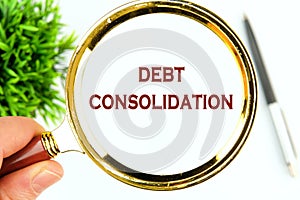 Debt consolidation. This is the process of obtaining a new loan to repay a number of existing debts. photo