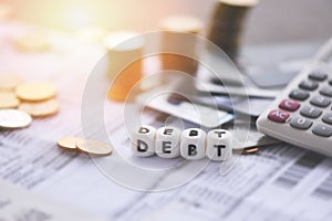 Debt credit card and money coin stack - Increased liabilities from exemption debt consolidation concept of financial crisis and photo