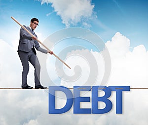 Debt and loan concept with businessman walking on tight rope