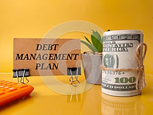 DEBT MANAGEMENT PLAN on a yellow background